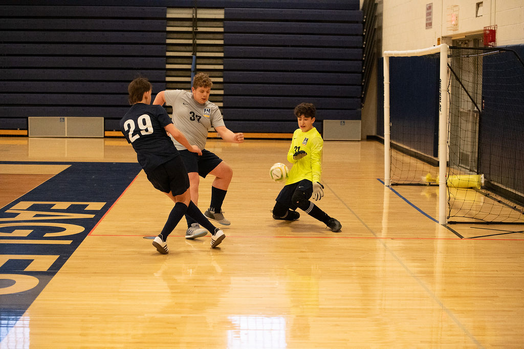 Wayne United attacker taking on the keeper during an indoor game